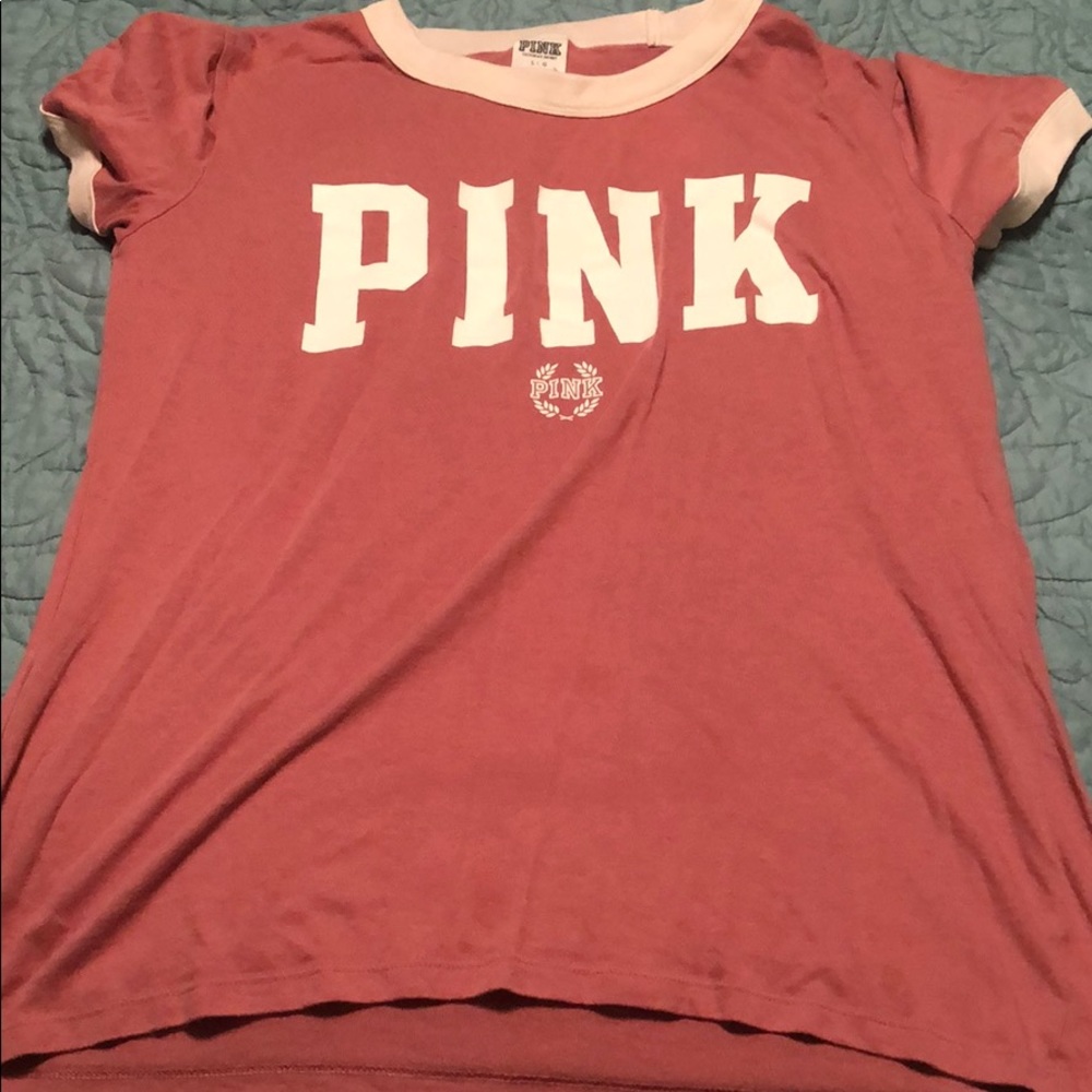 a pink victoria secret shirt